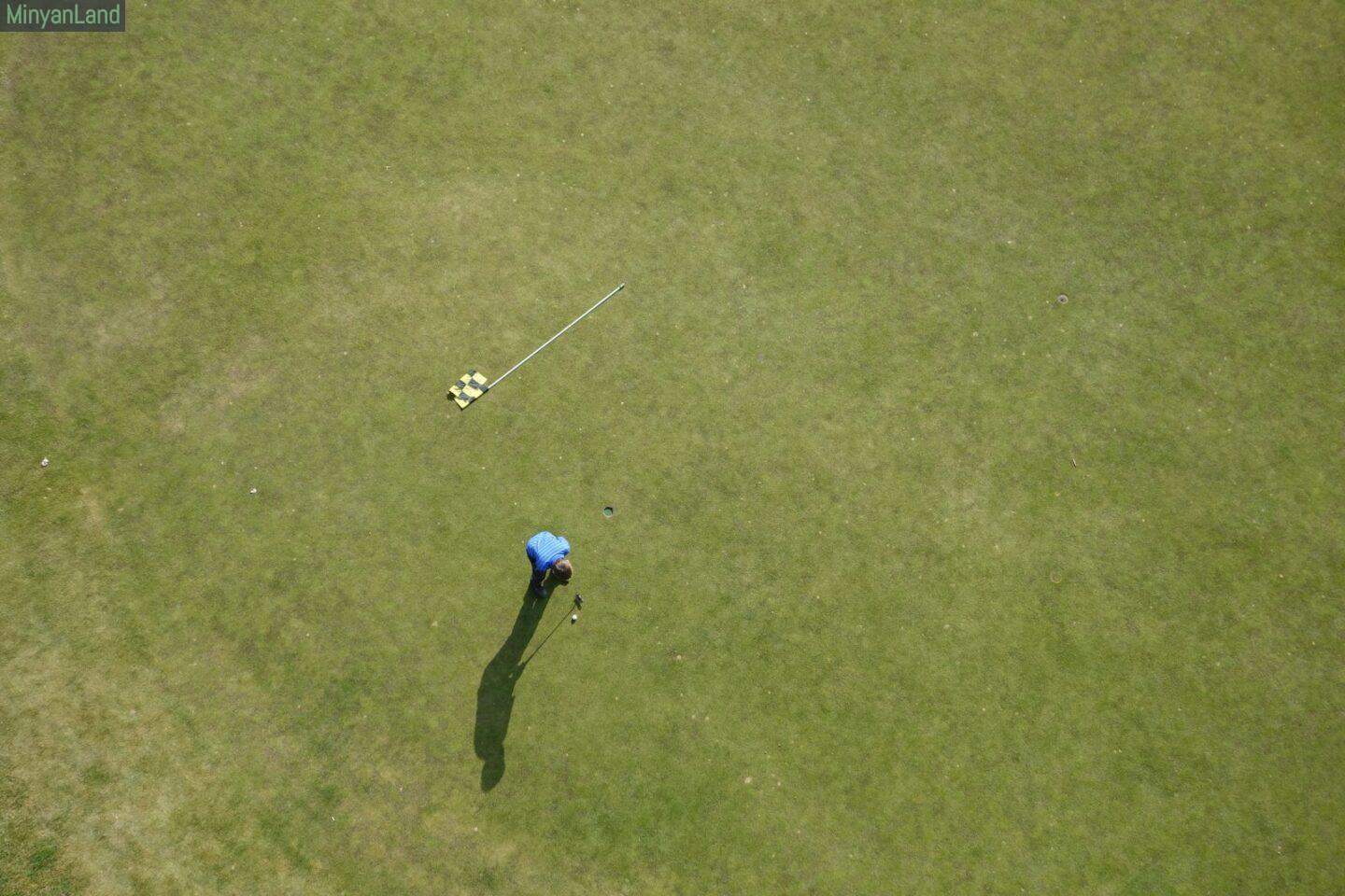 aerial photo of man playing golf